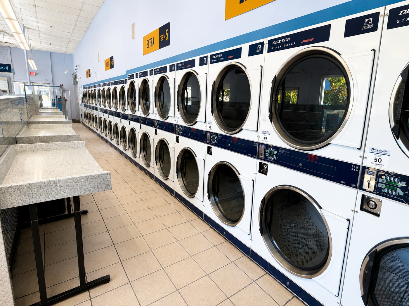 Dryer aisle and folding counters at WashFoundry Sunnyvale